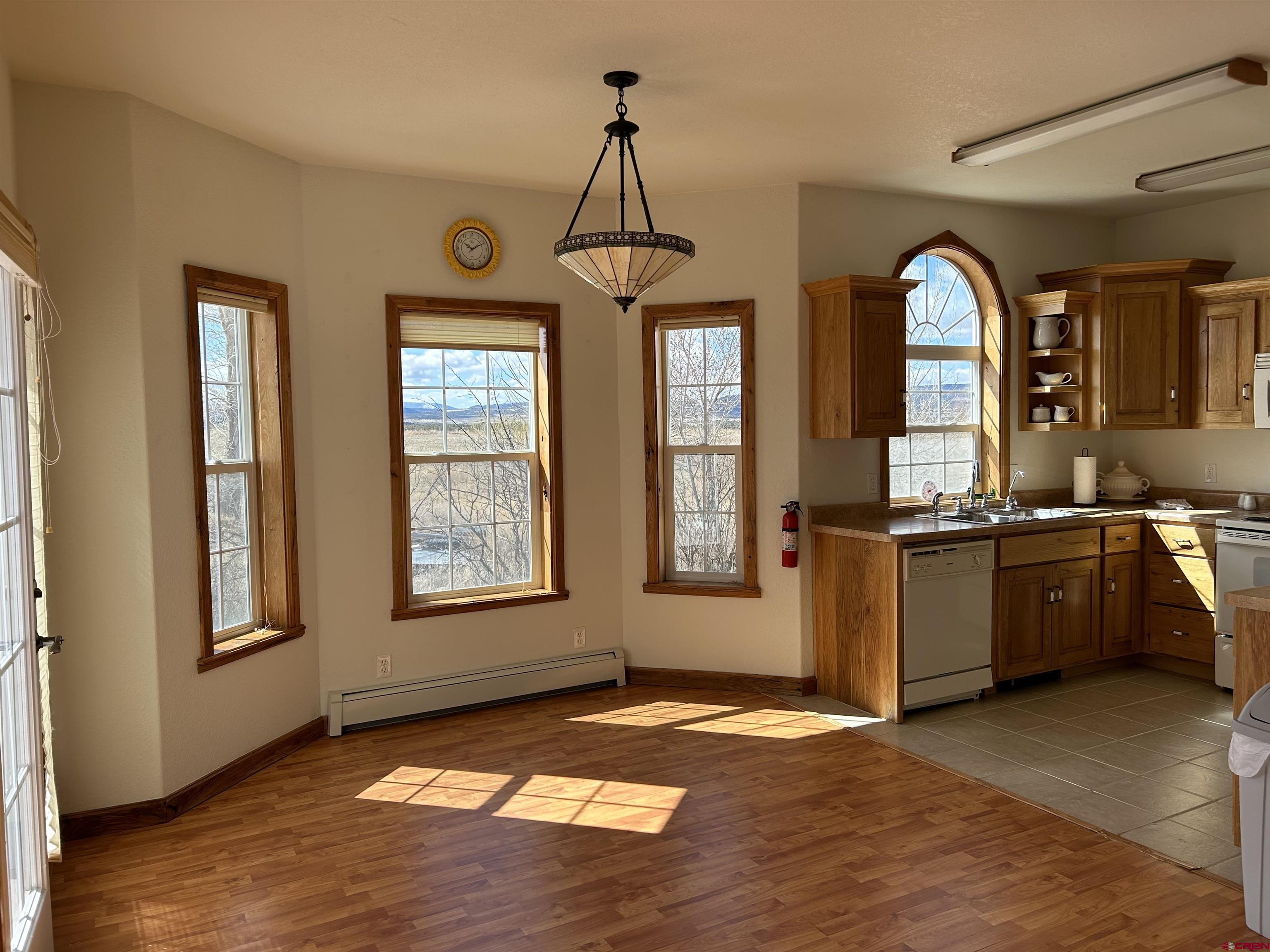 32116 Highway 145 Redvale, CO 81431 - Photo 11 of 28 a view of a kitchen with an entryway and a window