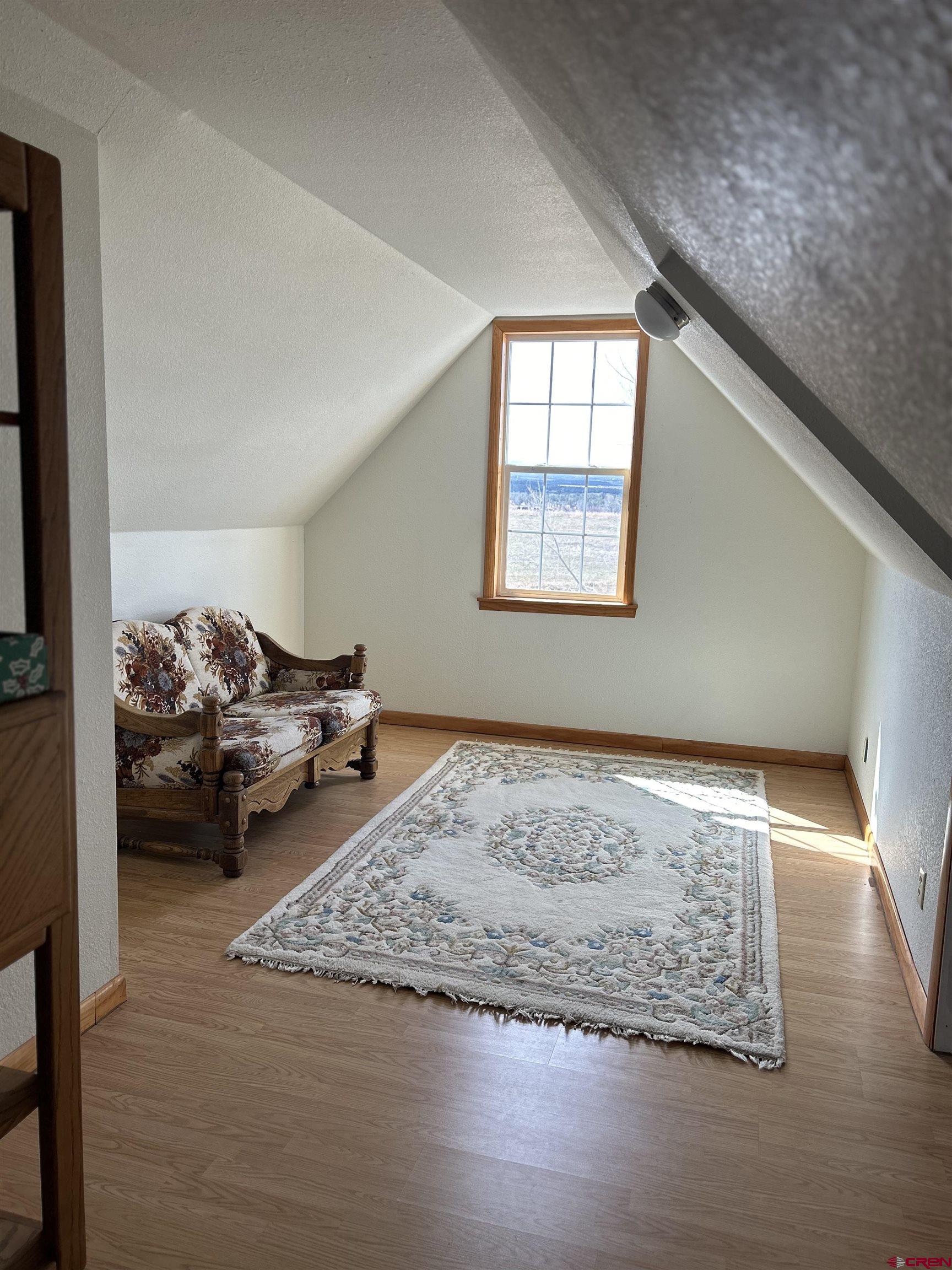 32116 Highway 145 Redvale, CO 81431 - Photo 20 of 28 a living room with furniture and a wooden floor