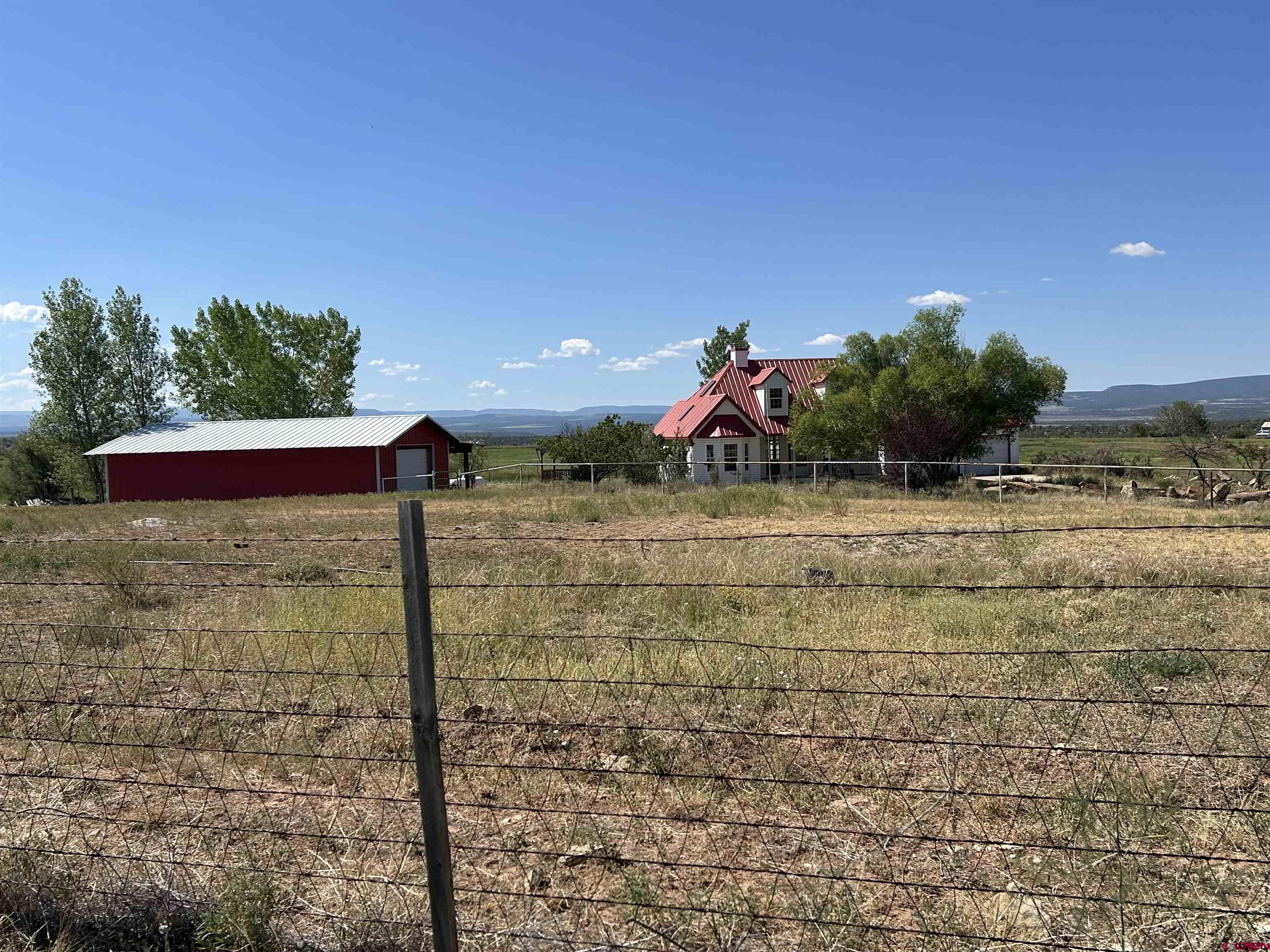 32116 Highway 145 Redvale, CO 81431 - Photo 2 of 28 a view of a road with an outdoor space