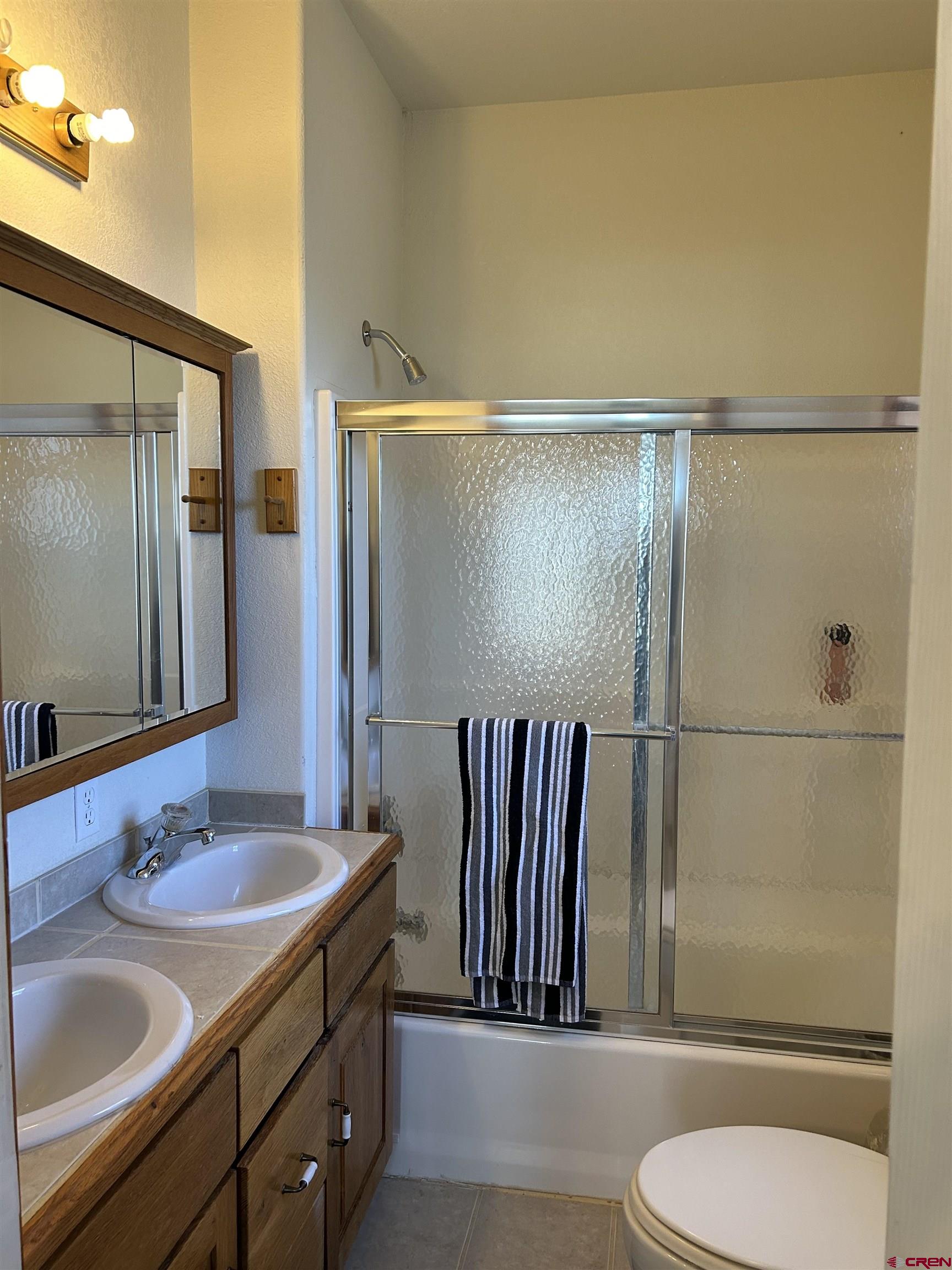 32116 Highway 145 Redvale, CO 81431 - Photo 21 of 28 a bathroom with a sink a toilet and shower