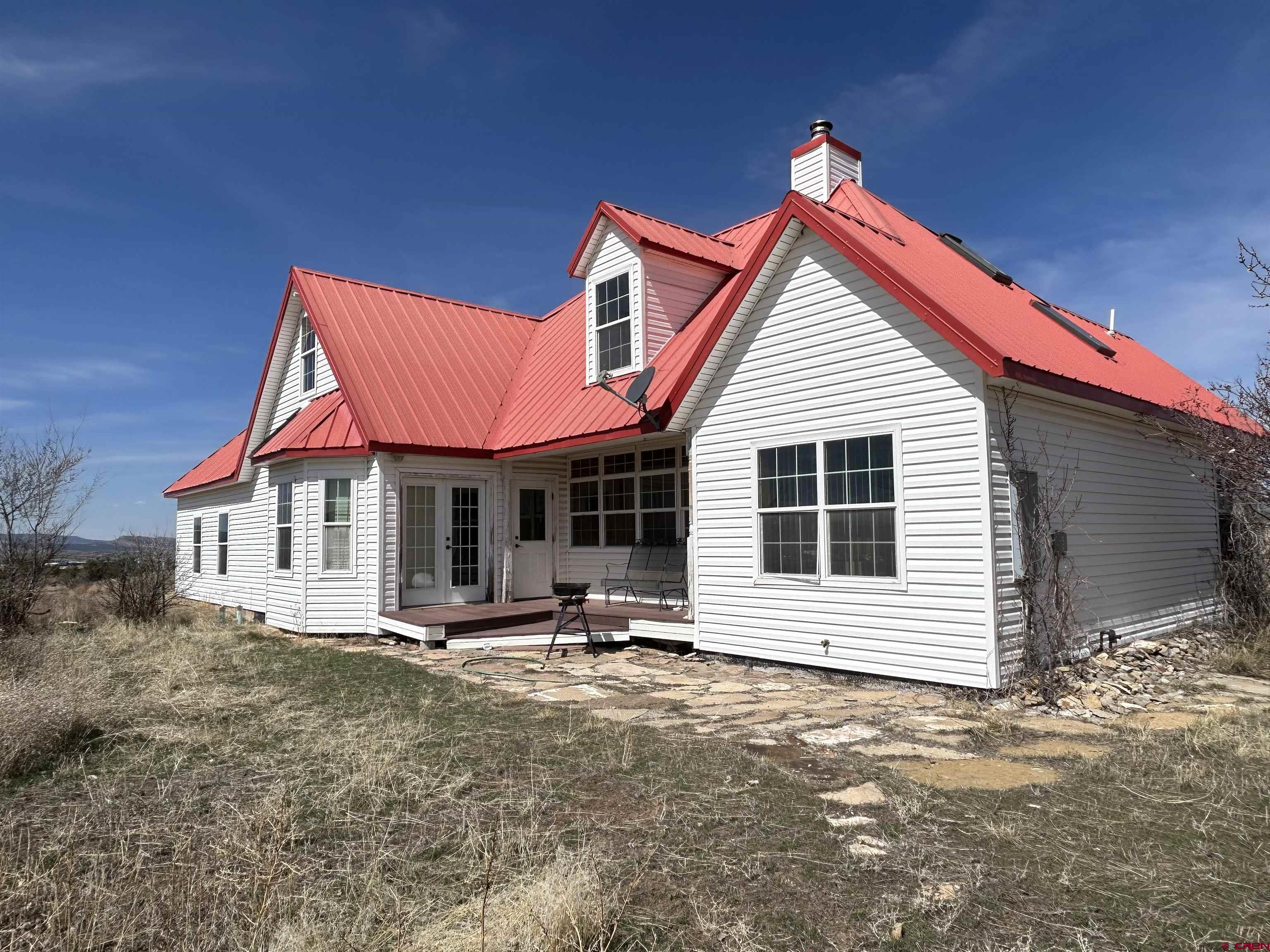 32116 Highway 145 Redvale, CO 81431 - Photo 3 of 28 a view of a house with wooden walls