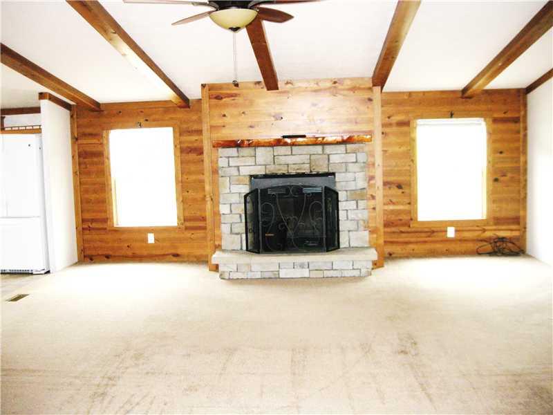 202 Rustic Ridge Lane Butler, PA 16002 - Photo 6 of 19 Living Room. Living room has a beautiful wood burning fireplace.