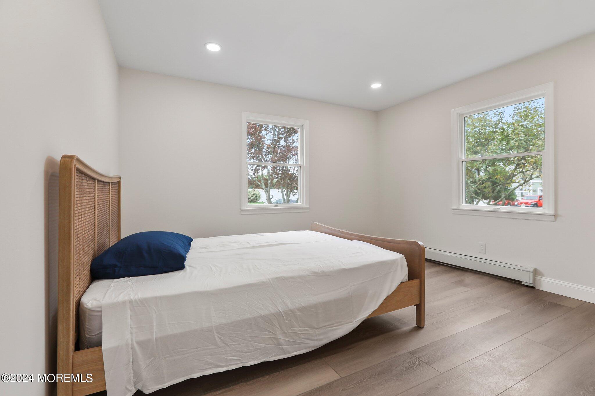 1419 Joseph Street Point Pleasant, NJ 08742 - Photo 13 of 27 a bedroom with a bed and a window