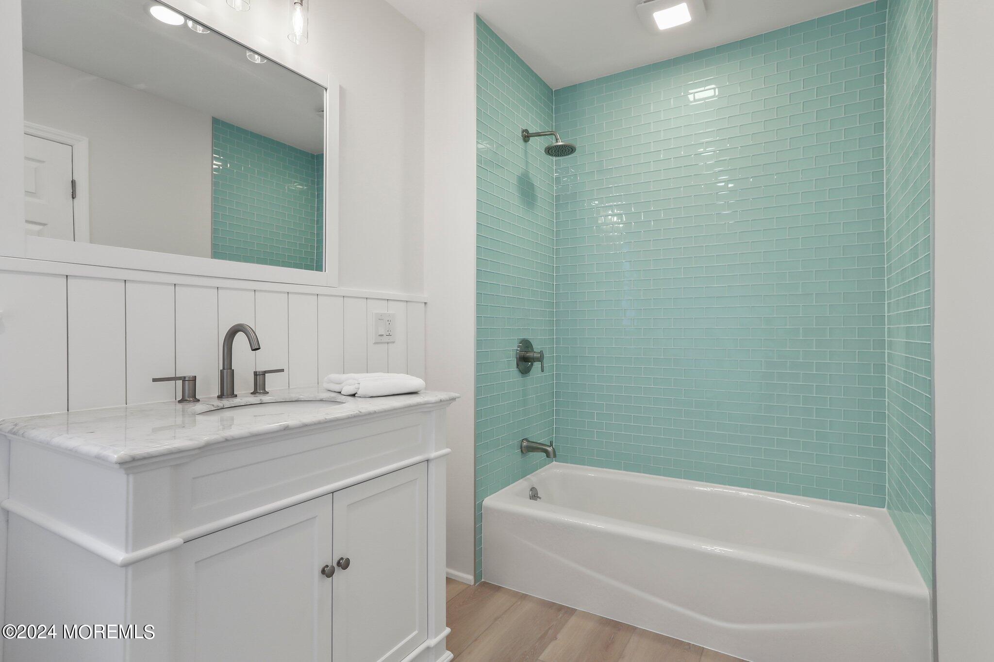 1419 Joseph Street Point Pleasant, NJ 08742 - Photo 15 of 27 a bathroom with a sink a toilet and shower