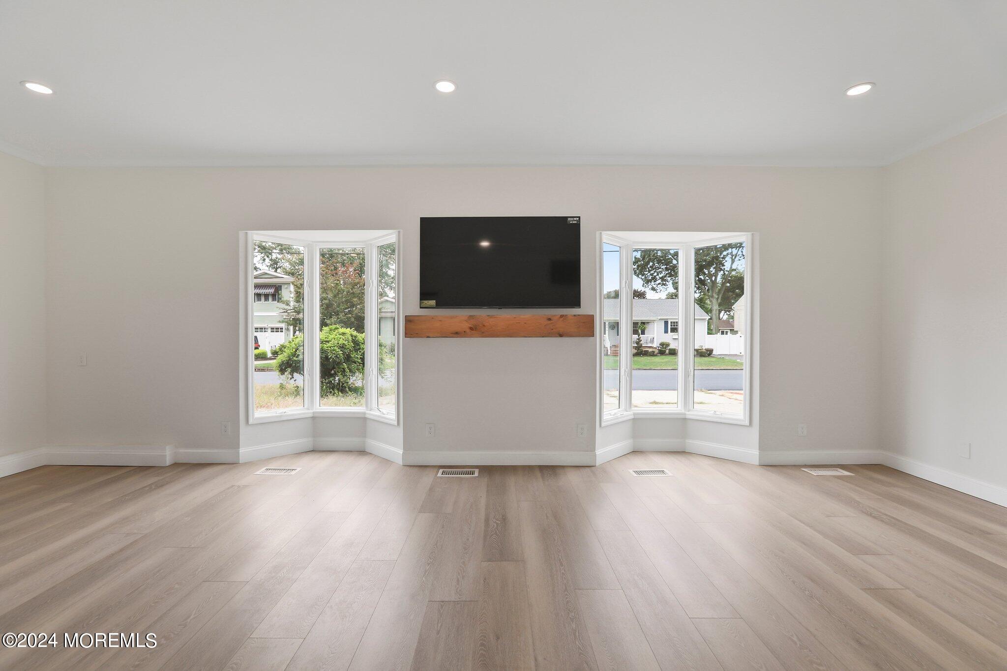 1419 Joseph Street Point Pleasant, NJ 08742 - Photo 19 of 27 wooden floor in an empty room with a window