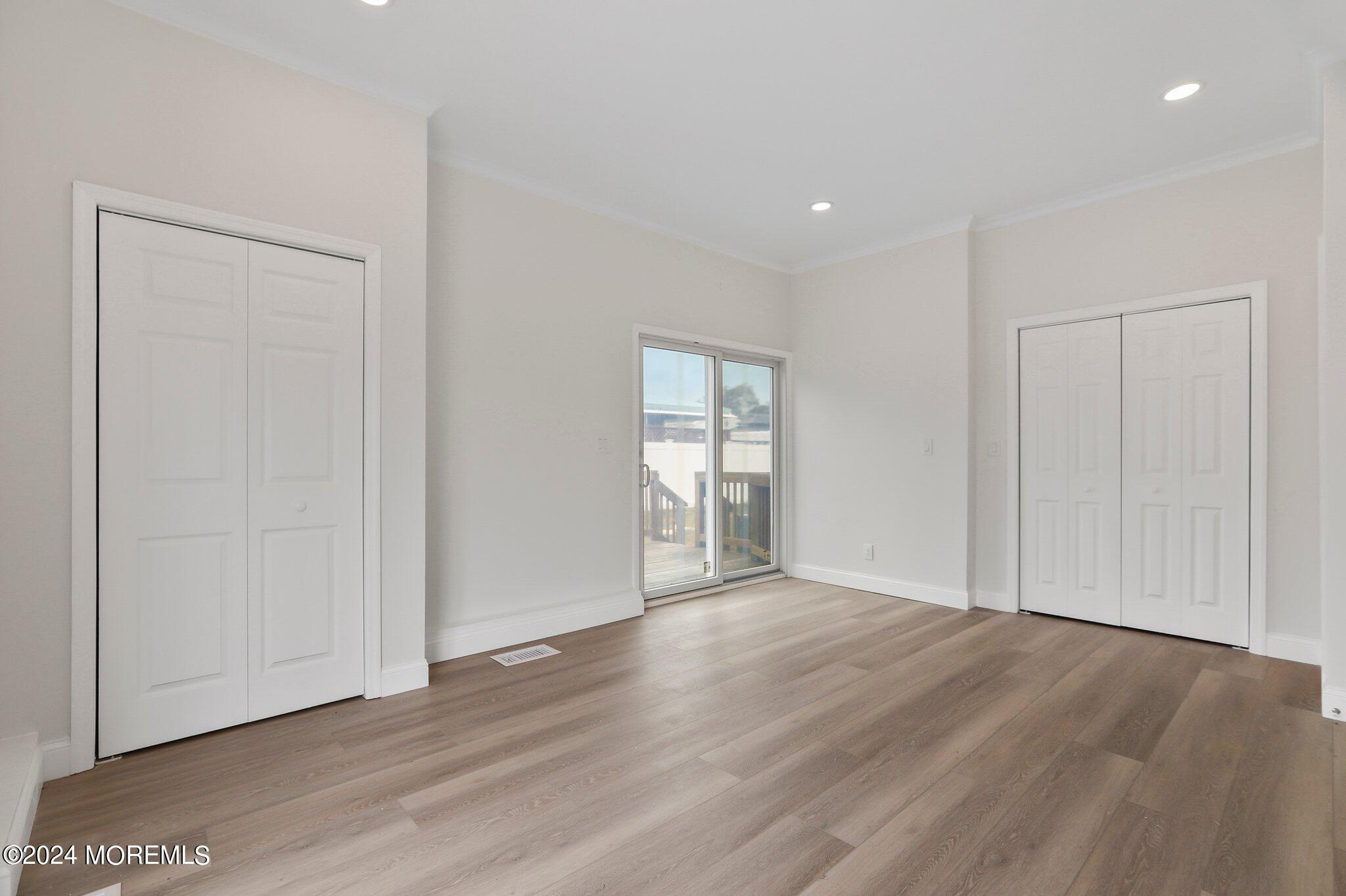 1419 Joseph Street Point Pleasant, NJ 08742 - Photo 21 of 27 a view of an empty room with wooden floor and closet