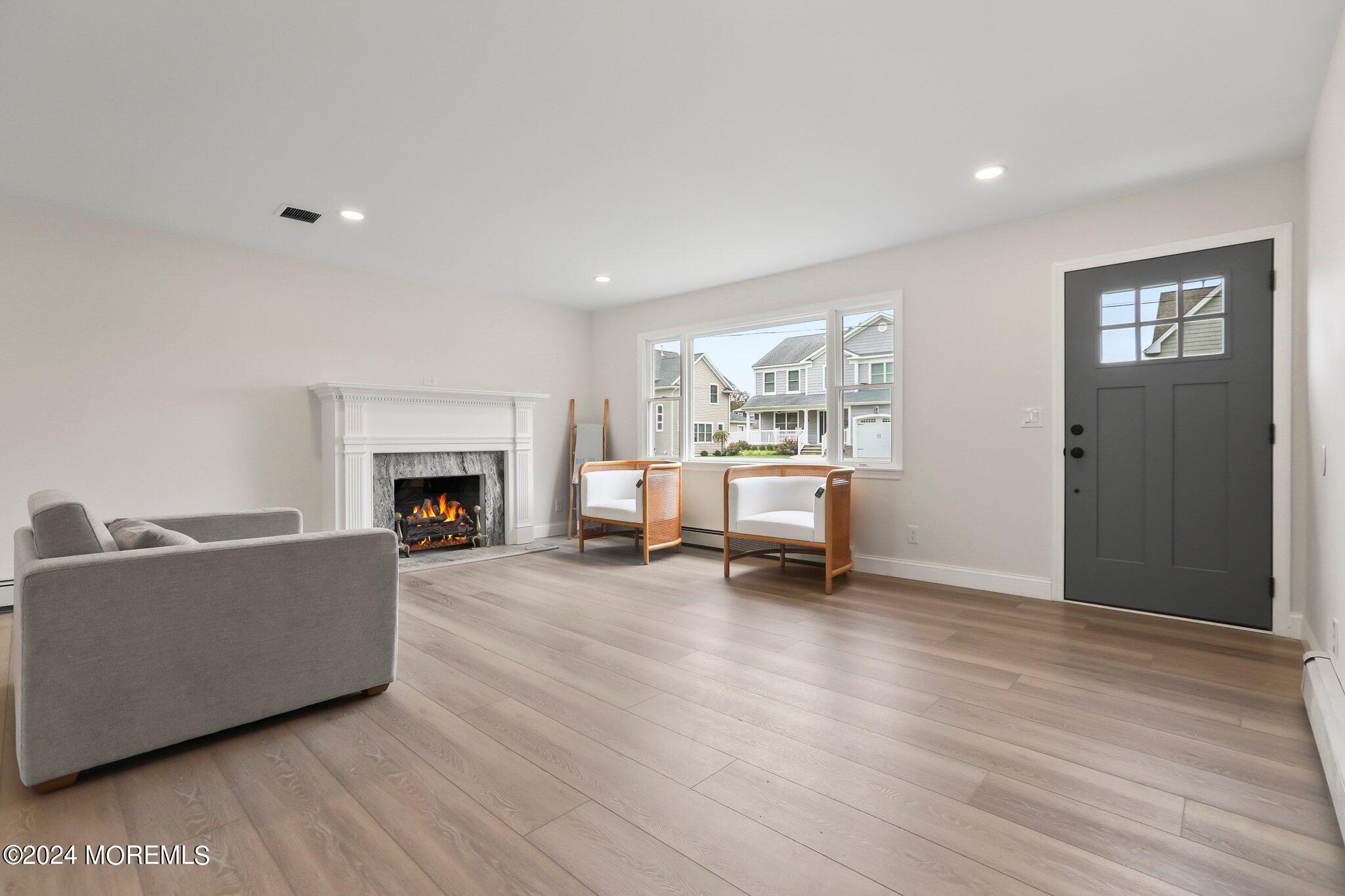 1419 Joseph Street Point Pleasant, NJ 08742 - Photo 3 of 27 a living room with furniture and a fireplace