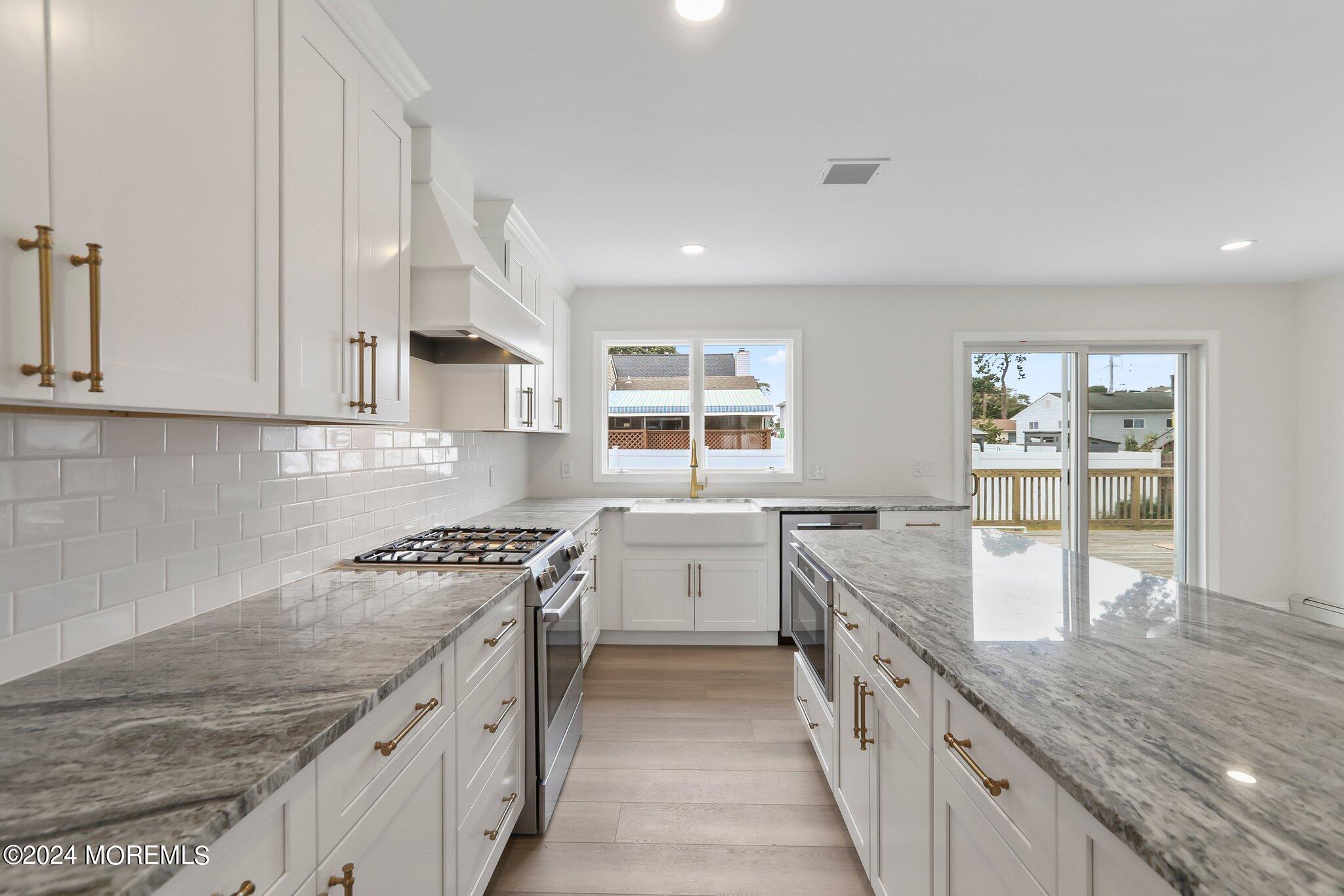 1419 Joseph Street Point Pleasant, NJ 08742 - Photo 8 of 27 a kitchen with granite countertop lots of counter top space and stainless steel appliances