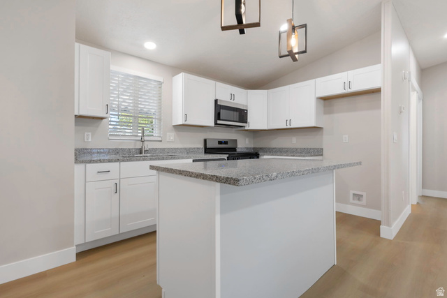 96 Barrington Way Layton, UT 84041 - Photo 1 of 28 Kitchen with white cabinets, stainless steel appliances, hanging light fixtures, a center island, and light wood finished floors