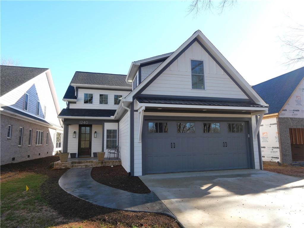 1240 6th Street Northwest Hickory, NC 28601 - Photo 1 of 48 a front view of a house with garden