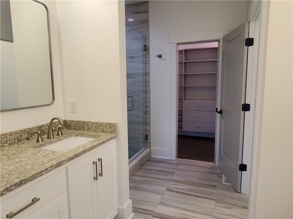 1240 6th Street Northwest Hickory, NC 28601 - Photo 24 of 48 a bathroom with a sink and a mirror