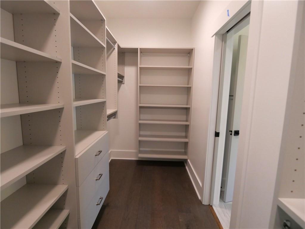 1240 6th Street Northwest Hickory, NC 28601 - Photo 26 of 48 a view of walk in closet with empty racks