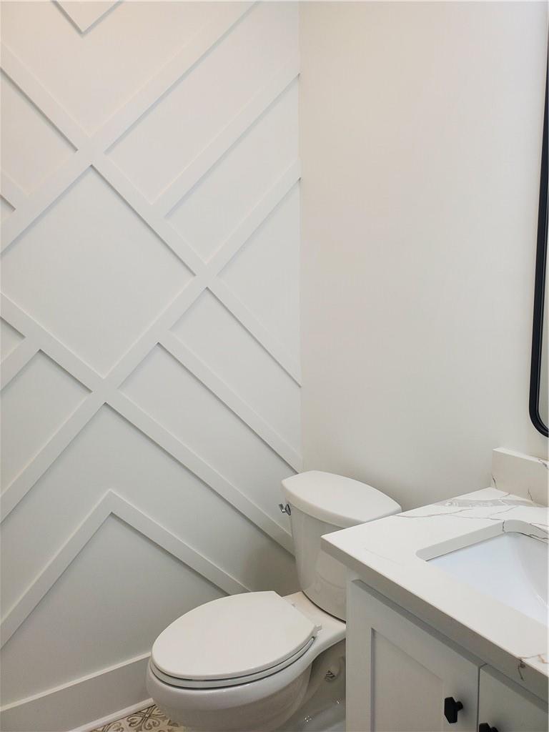 1240 6th Street Northwest Hickory, NC 28601 - Photo 29 of 48 a white toilet sitting next to a bathroom sink