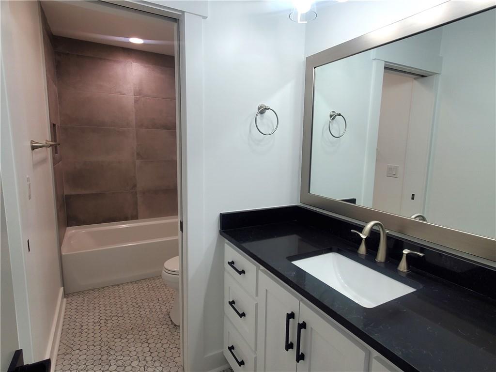 1240 6th Street Northwest Hickory, NC 28601 - Photo 32 of 48 a bathroom with a sink and a mirror
