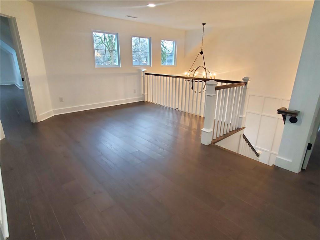 1240 6th Street Northwest Hickory, NC 28601 - Photo 40 of 48 a view of a room with wooden floor fan and windows