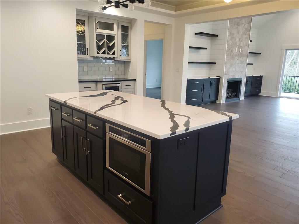 1240 6th Street Northwest Hickory, NC 28601 - Photo 4 of 48 a kitchen with stainless steel appliances granite countertop a stove and a sink