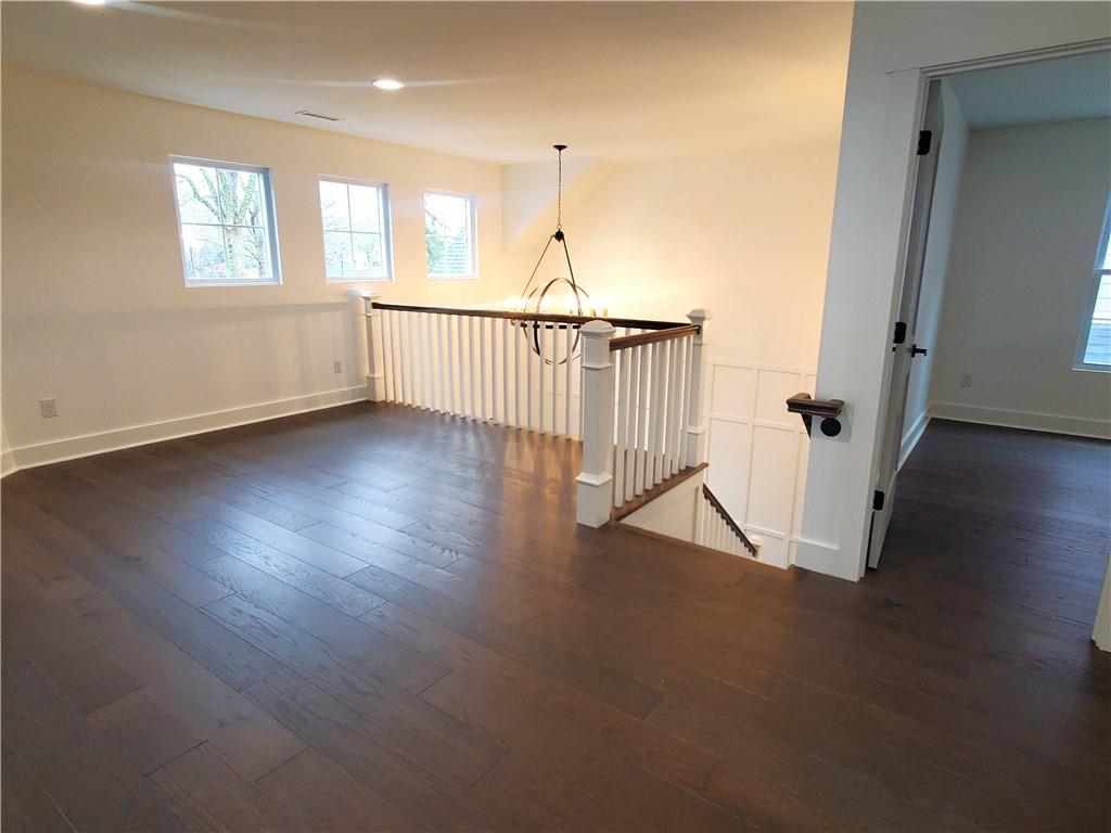 1240 6th Street Northwest Hickory, NC 28601 - Photo 41 of 48 an empty room with wooden floor and windows