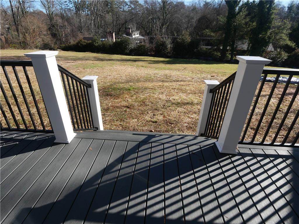 1240 6th Street Northwest Hickory, NC 28601 - Photo 44 of 48 a view of a backyard with wooden floor and fence