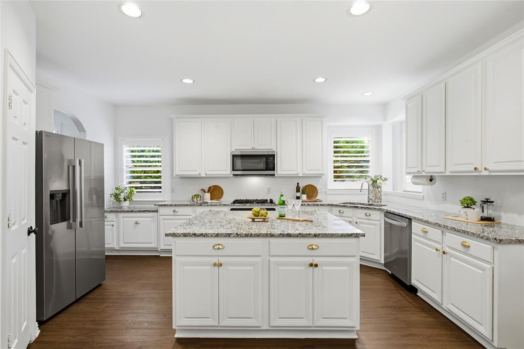 5201 Geode Lane McKinney, TX 75072 - Photo 12 of 37 Giant island for entertaining or food prep. This kitchen has tons of cabinets for storage and walk in pantry. The stainless steel refrigerator conveys with home.