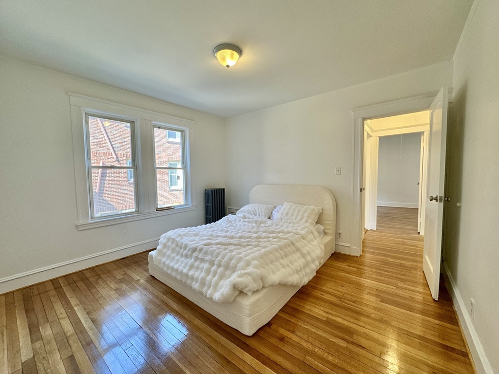 14 Hooper Street, Unit 1 Boston, MA 02124 - Photo 10 of 14 a bedroom with a bed and window