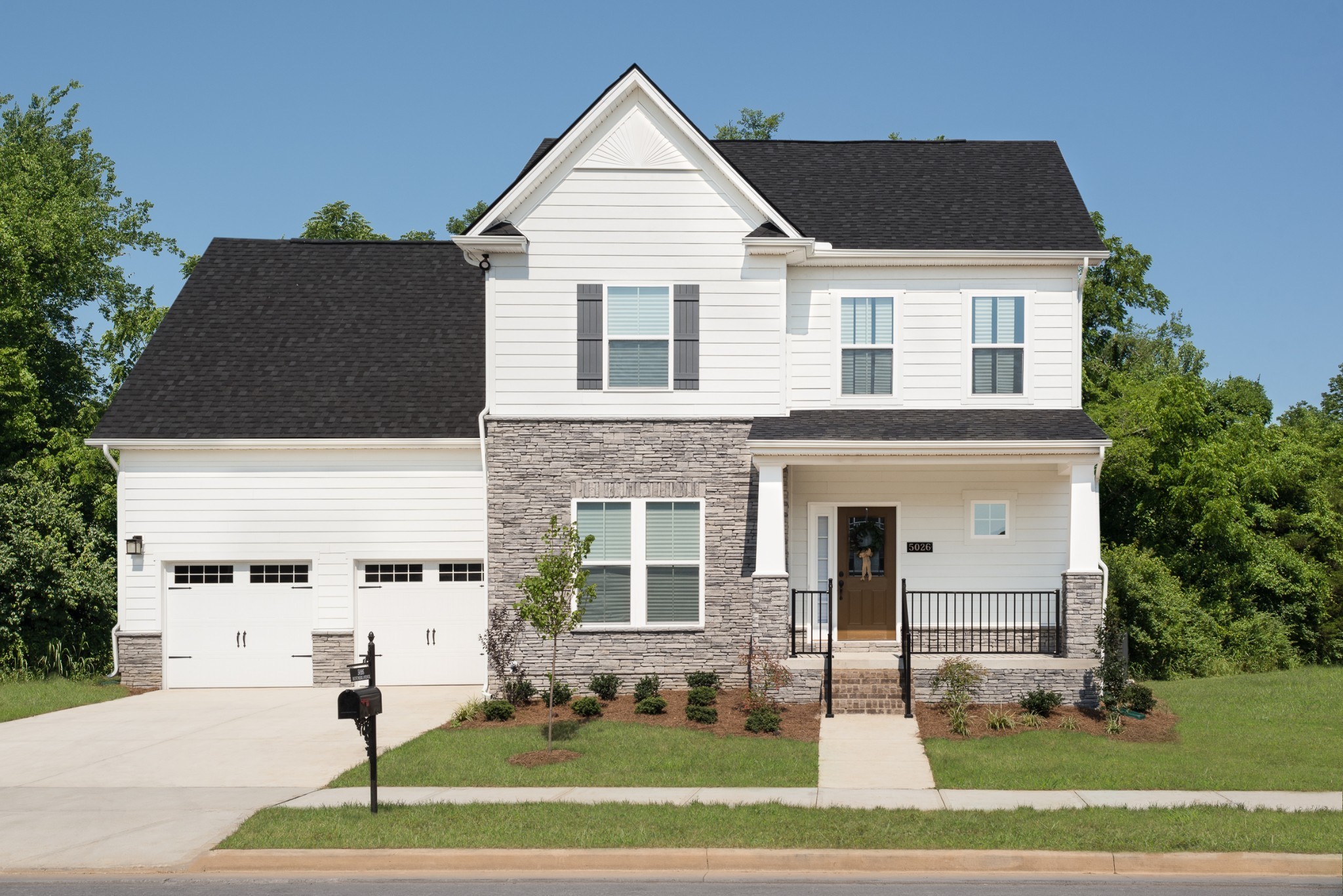 4032 Oglethorpe Drive Franklin, TN 37064 - Photo 3 of 34 a front view of a house with a yard