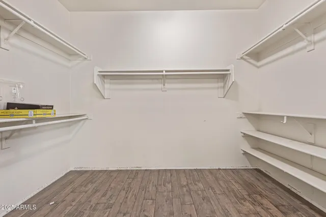 a view of an empty walk in closet