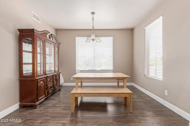 a view of an entryway with wooden floor and windows