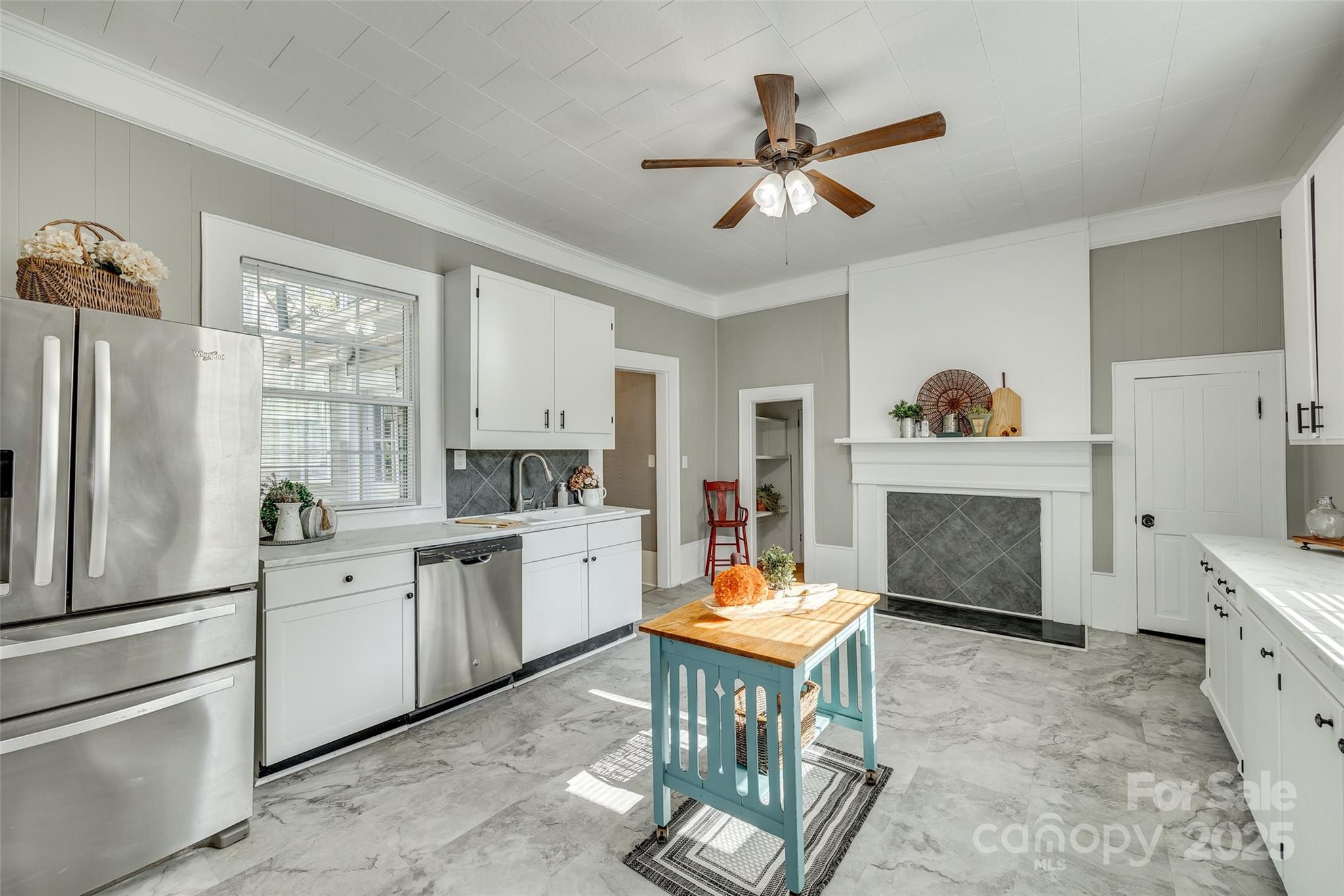 203 Kings Mountain Street Clover, SC 29710 - Photo 11 of 35 a kitchen with a refrigerator cabinets and wooden floor