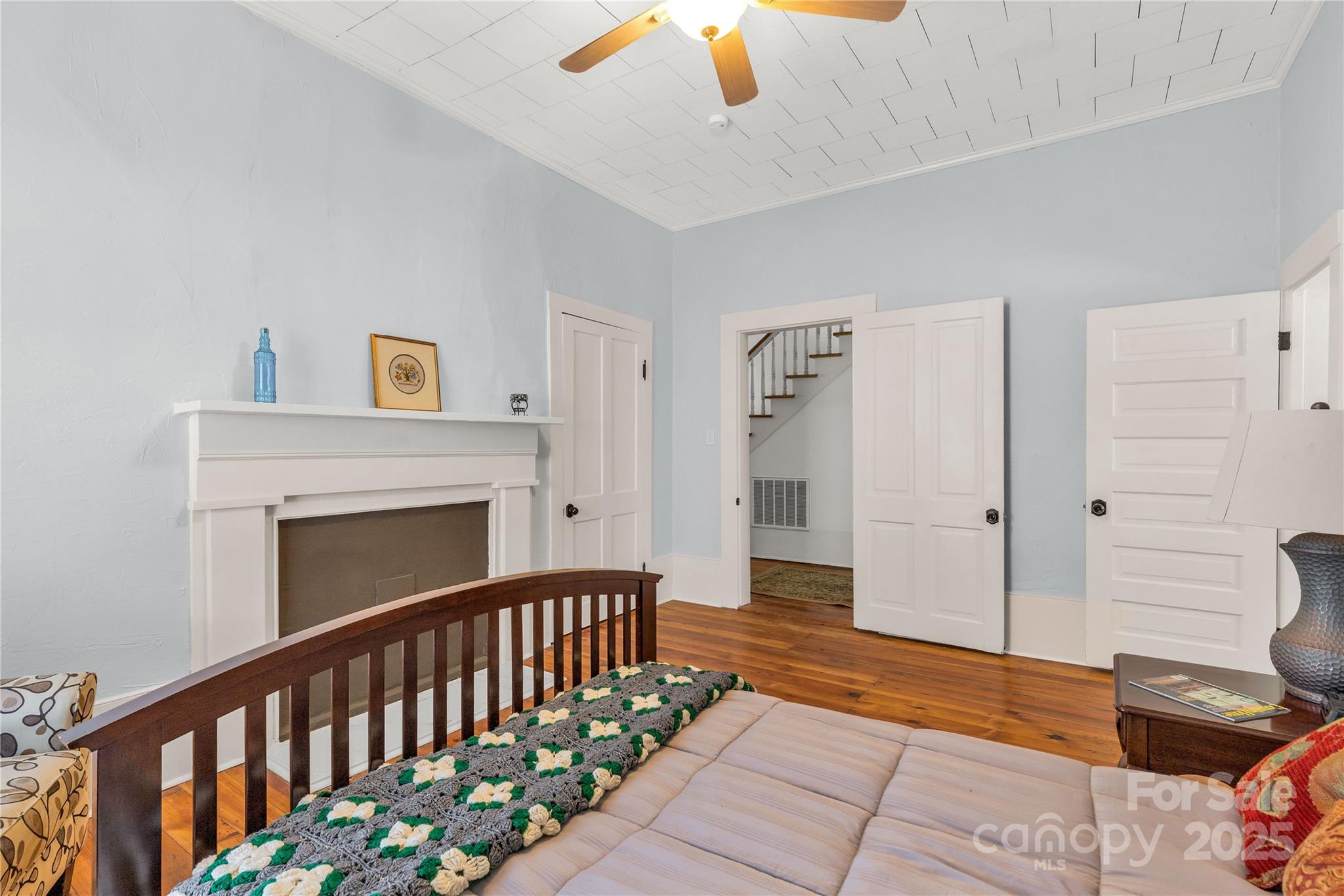 203 Kings Mountain Street Clover, SC 29710 - Photo 15 of 35 a bedroom with furniture and a fireplace