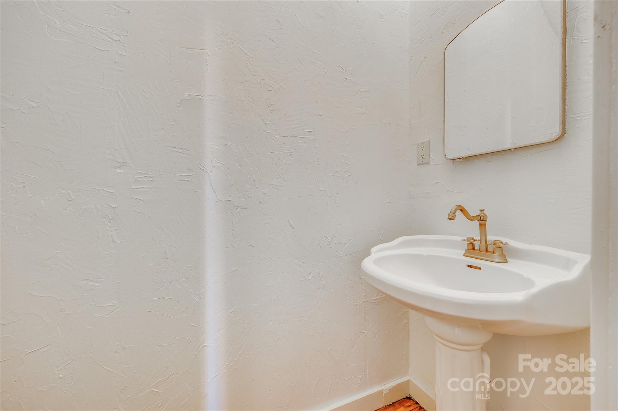 203 Kings Mountain Street Clover, SC 29710 - Photo 18 of 35 a bathroom with a sink and a mirror