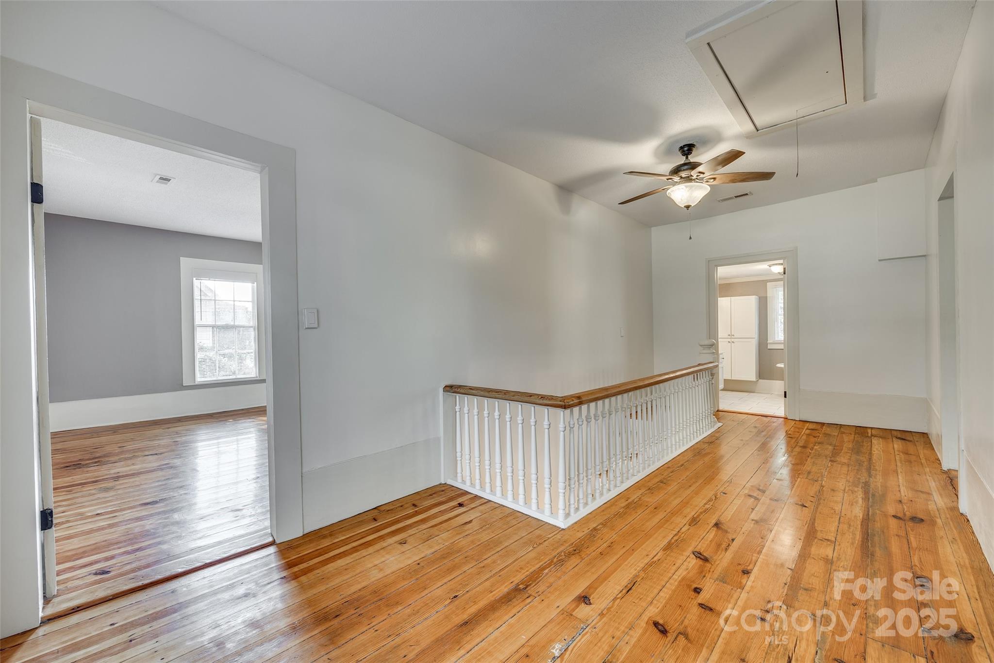 203 Kings Mountain Street Clover, SC 29710 - Photo 20 of 35 a view of an empty room with window and wooden floor