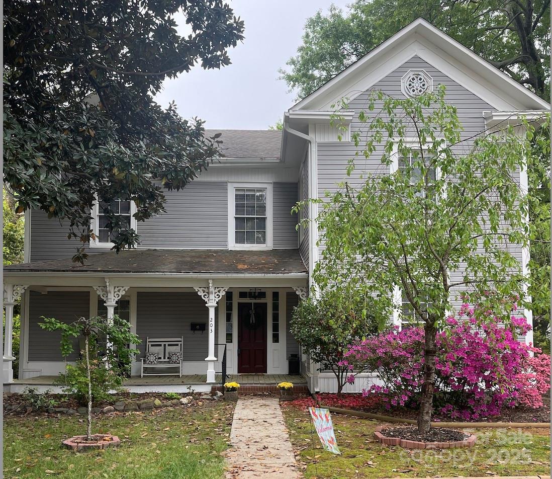 203 Kings Mountain Street Clover, SC 29710 - Photo 2 of 35 a front view of a house with garden