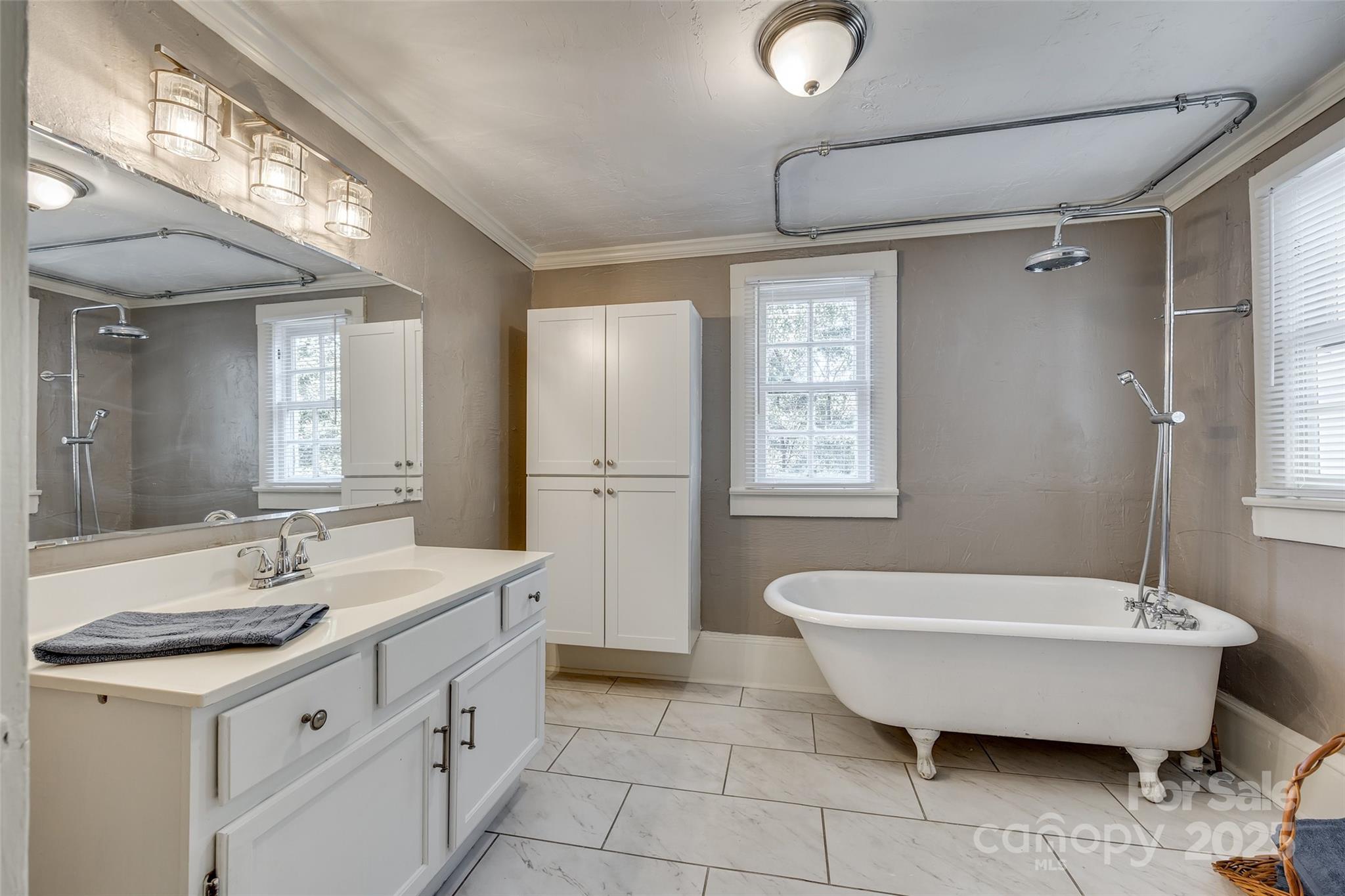 203 Kings Mountain Street Clover, SC 29710 - Photo 26 of 35 a spacious bathroom with a double vanity sink mirror and bathtub