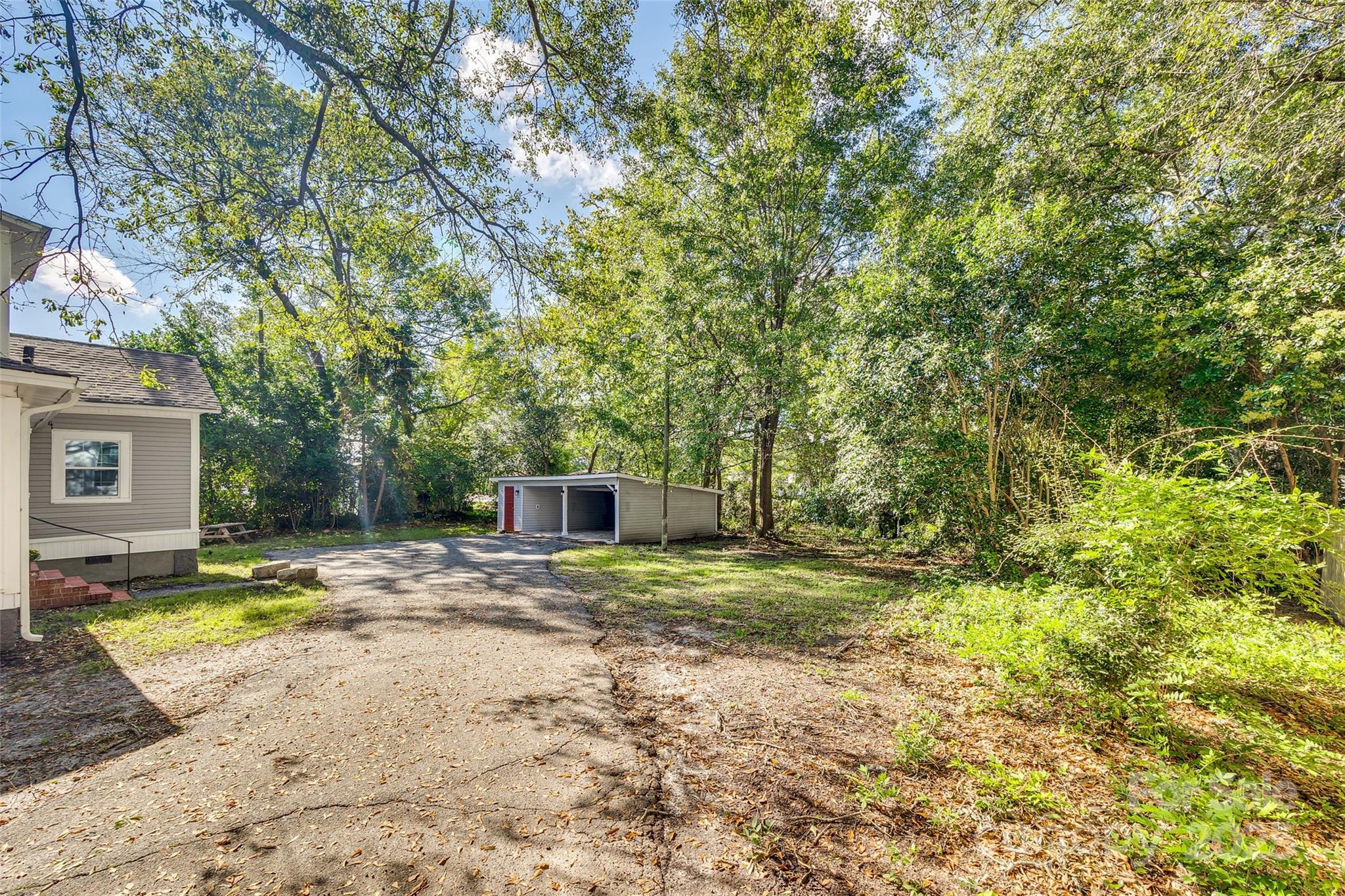 203 Kings Mountain Street Clover, SC 29710 - Photo 29 of 35 a view of a yard with plants and trees