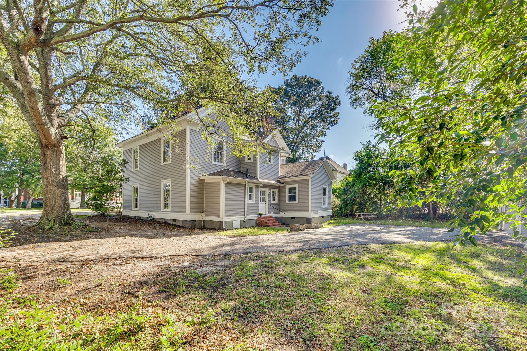 203 Kings Mountain Street Clover, SC 29710 - Photo 32 of 35 a front view of a house with a yard and trees