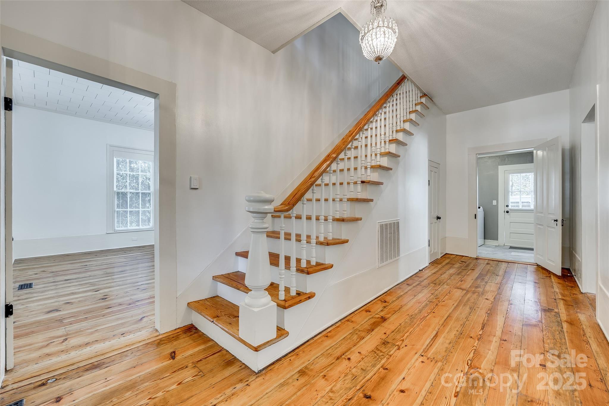 203 Kings Mountain Street Clover, SC 29710 - Photo 4 of 35 a view of an entryway with wooden floor and staircase