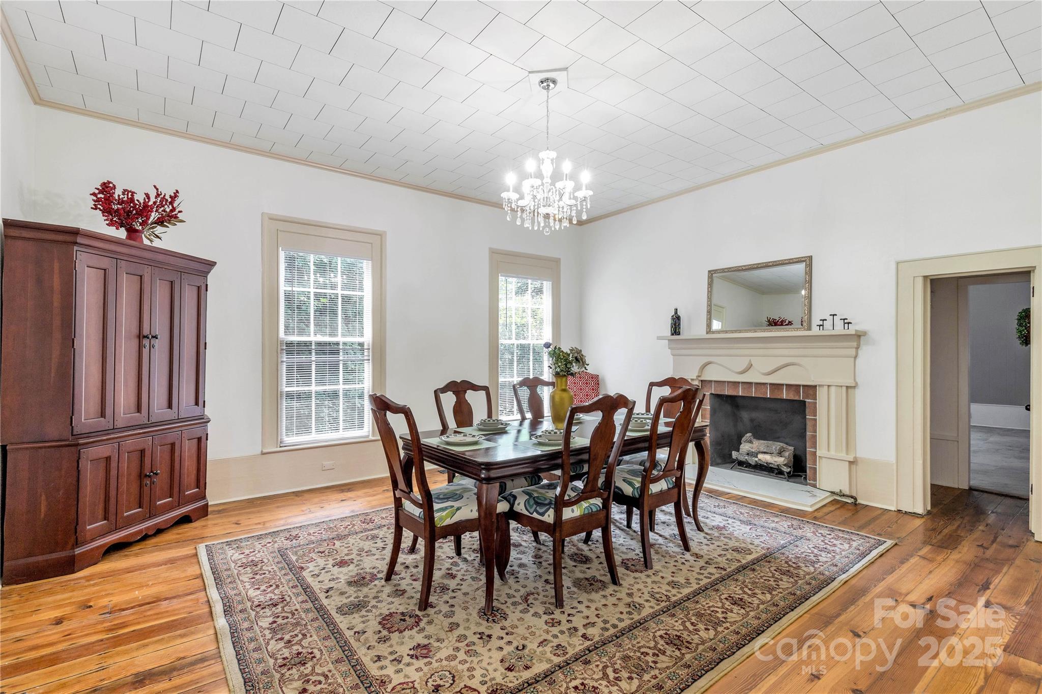 203 Kings Mountain Street Clover, SC 29710 - Photo 6 of 35 a view of a dining room with furniture wooden floor and chandelier