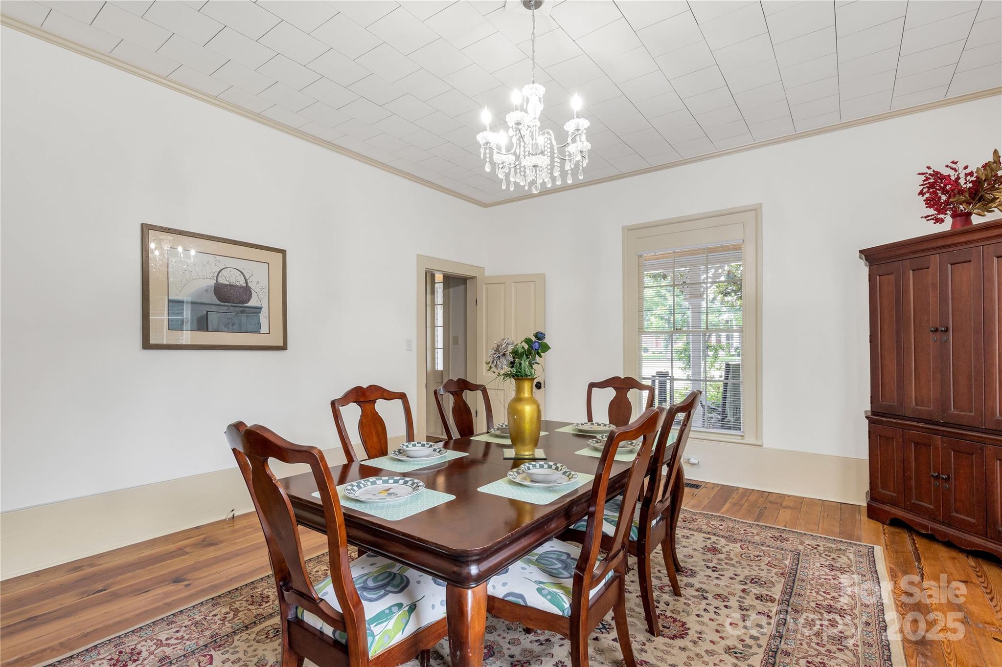 203 Kings Mountain Street Clover, SC 29710 - Photo 7 of 35 a dining room with furniture a rug and a chandelier