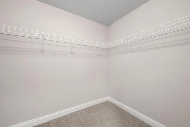 a swimming pool with outdoor seating and yard