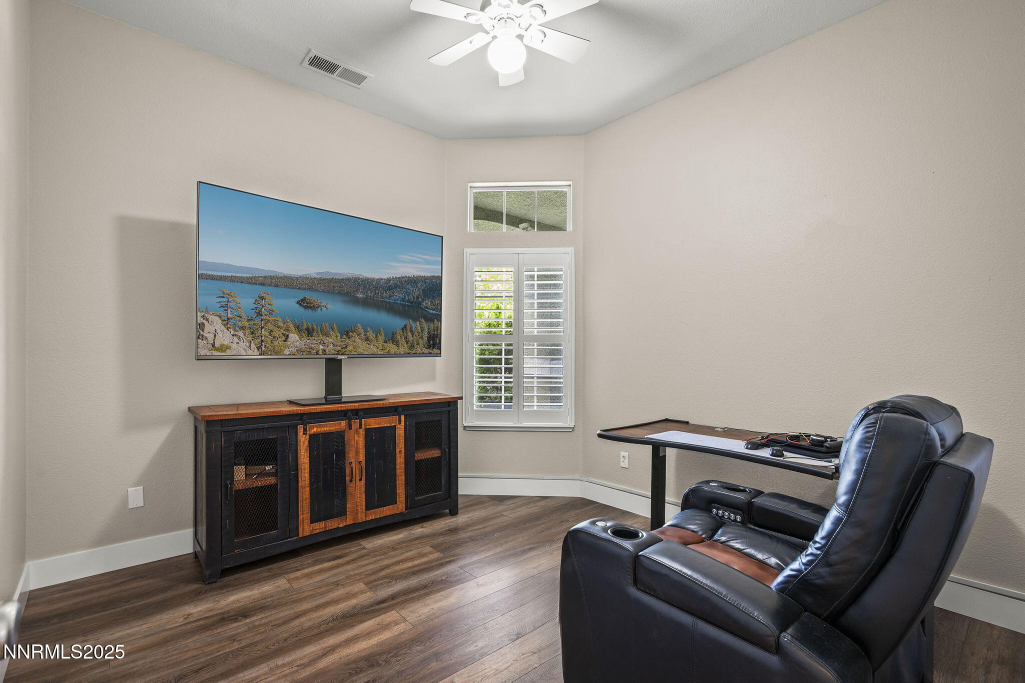 1660 Murrieta Court Reno, NV 89521 - Photo 22 of 39 a living room with furniture and a flat screen tv