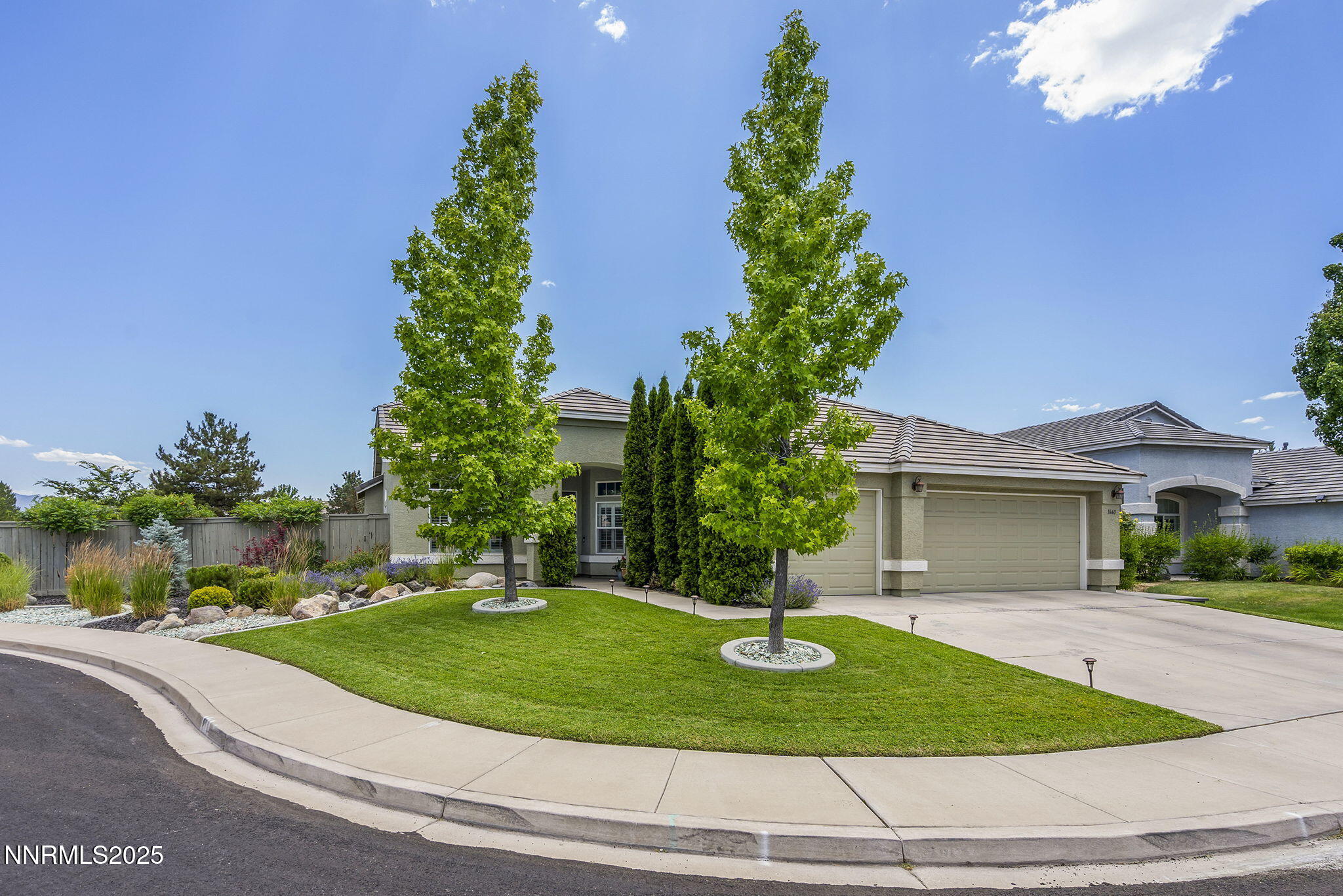 1660 Murrieta Court Reno, NV 89521 - Photo 38 of 39 a front view of a house with a yard and potted plants