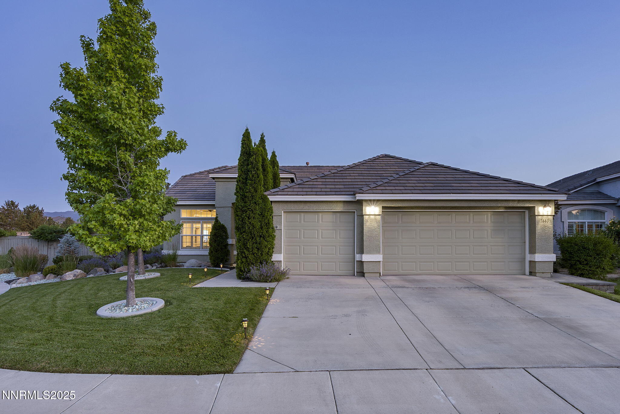 1660 Murrieta Court Reno, NV 89521 - Photo 4 of 39 front view of a house with yard and trees
