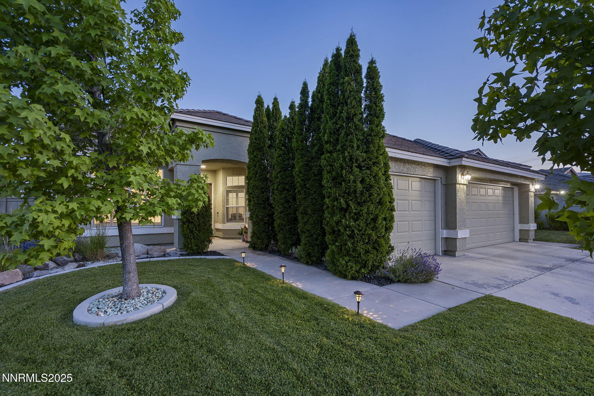 1660 Murrieta Court Reno, NV 89521 - Photo 5 of 39 a view of a backyard with plants and a patio