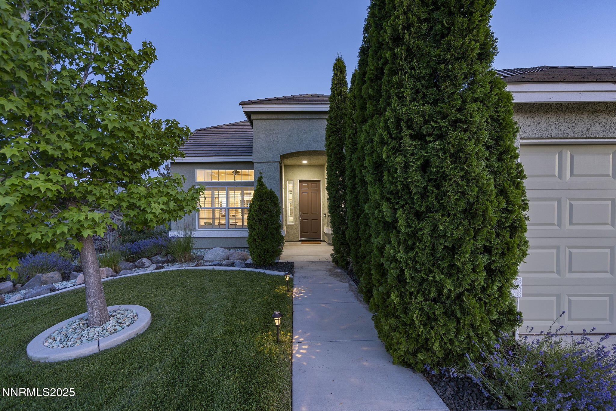 1660 Murrieta Court Reno, NV 89521 - Photo 6 of 39 a front view of a house with garden