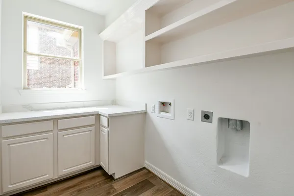 a view of cabinets with wooden floor