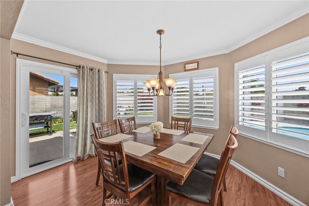 20257 Edmund Road Riverside, CA 92508 - Photo 23 of 53 a dining room with furniture window wooden floor
