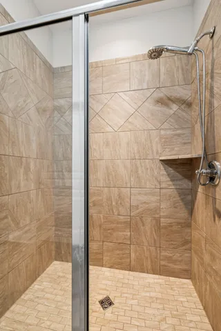 a bedroom with a bed and a chair