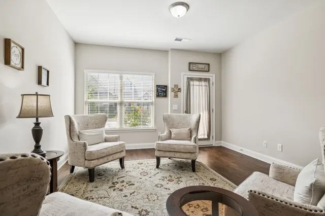 a living room with furniture and a window