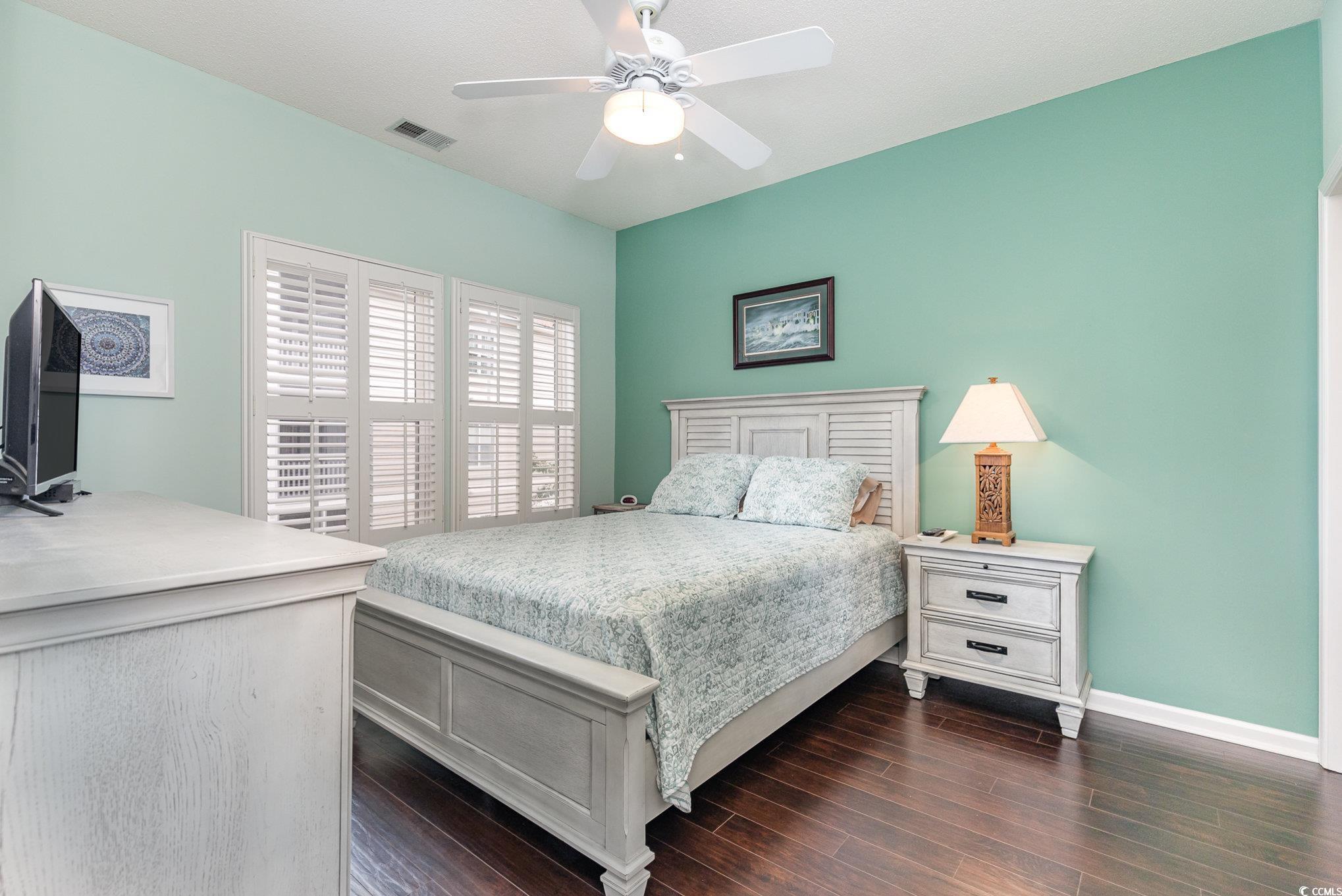2478 Coastline Court, Unit 202 Murrells Inlet, SC 29576 - Photo 12 of 33 Bedroom with dark wood-type flooring and ceiling f