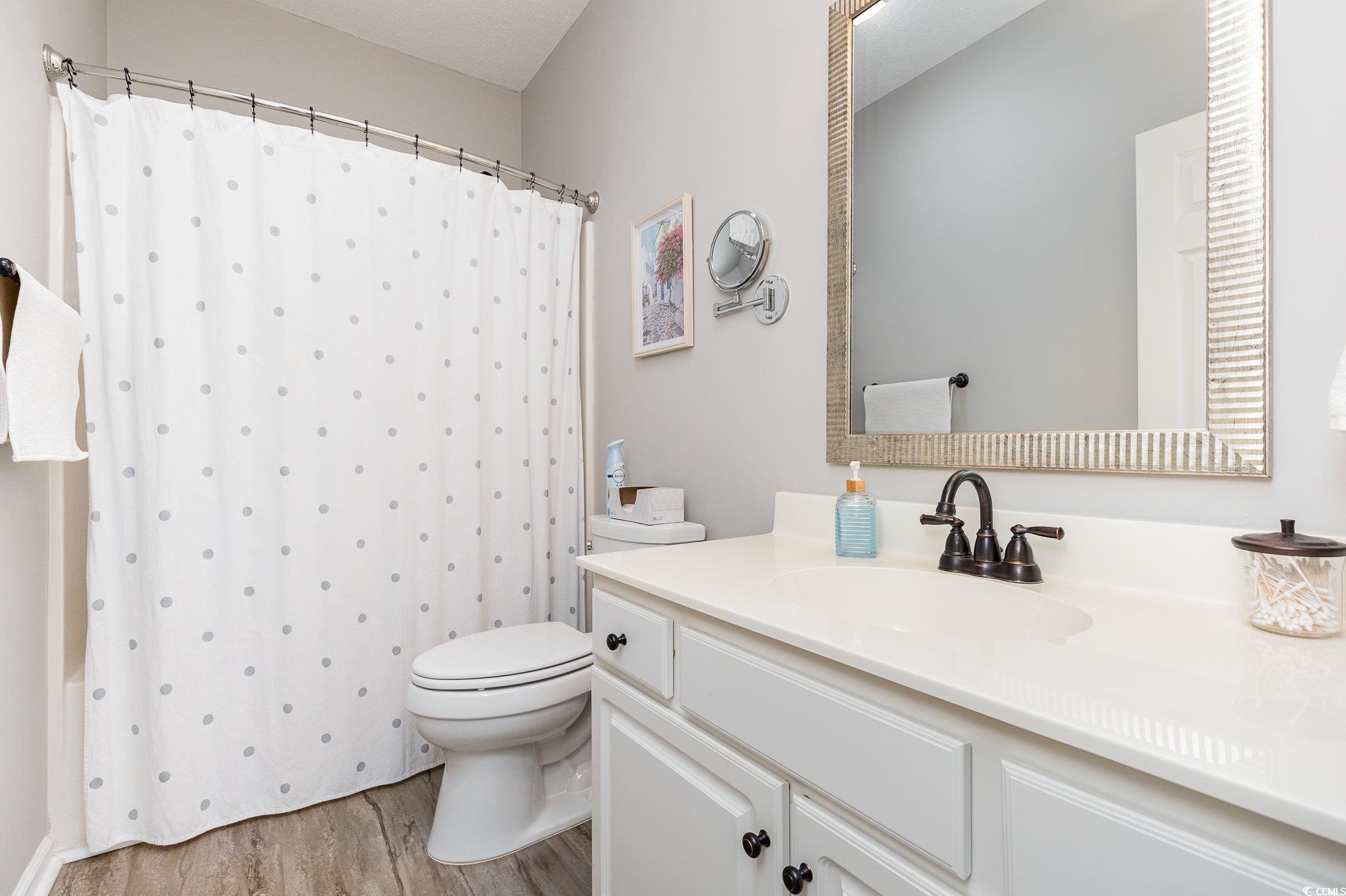 2478 Coastline Court, Unit 202 Murrells Inlet, SC 29576 - Photo 15 of 33 Bathroom with a shower with shower curtain, vanity